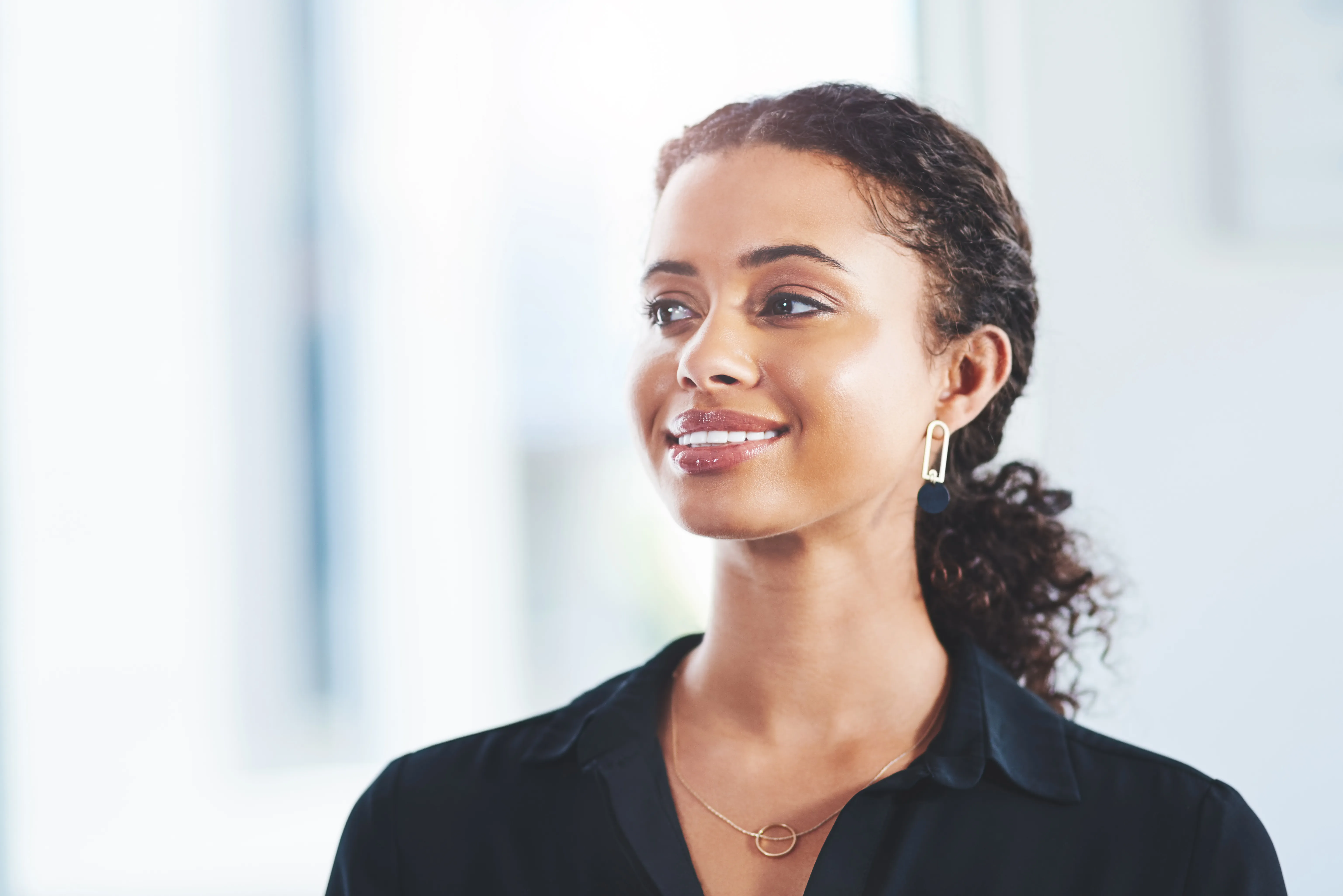 Woman smiling — Flatigo visa and immigration services